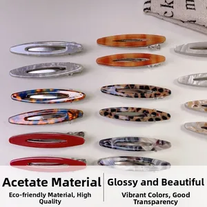 Various acetate hair clips with leopard, marble, and solid patterns on a white background