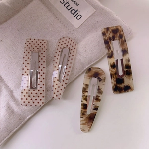 4-piece set of leopard print and polka dot vintage acrylic hair clips in various shapes