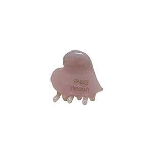 Pink heart-shaped acetate hair claw clip with France Handmade lettering in white background