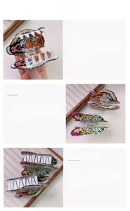 Detailed close-up showing acetate leopard and tiger head hair claws with smooth white teeth