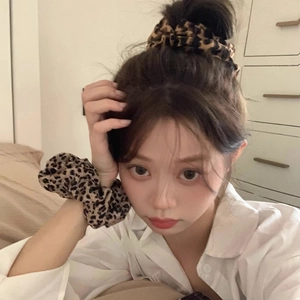 Stylish leopard print scrunchie set for women made of soft fabric for hair and wrist wear