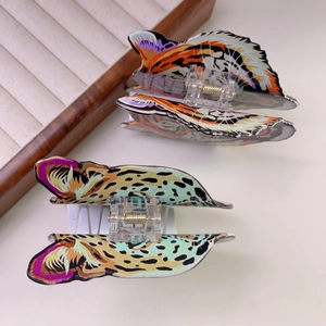 Acetate butterfly hair claws with leopard and tiger patterns for elegant hairstyling