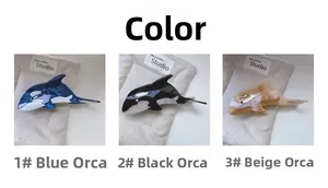 Whale-shaped hair claw clips in blue, black, and beige colors with marble acetate texture