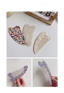 Detail showing acetate hair combs with colorful terrazzo and marble patterns