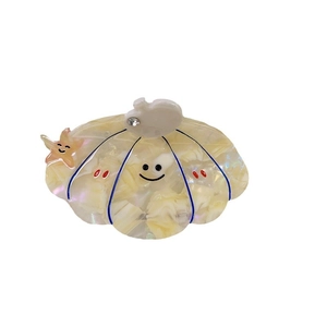 Cute shell shaped hair claw clip in creamy white with starfish and smiley face