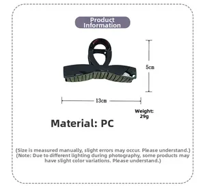 Detailed view of black ribbon hair claw clip measuring 13cm length and 5cm height