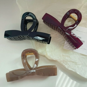 Set of 3 glossy oversized bow hair claws in black, burgundy, and coffee acrylic