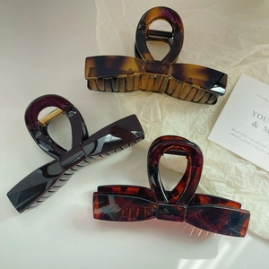 Three-piece set of large 13cm bow hair claws in amber, brown, and tortoiseshell finishes