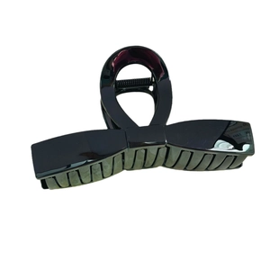 Classic large black bow claw clip with high-gloss finish for elegant hair styling