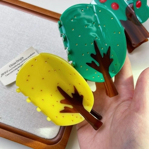 Creative tree shaped acetate shark hair clips in bright green and yellow for thick hair
