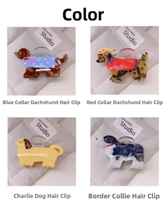 Quatre pinces à cheveux aux motifs de chiens comme le teckel et le border collie