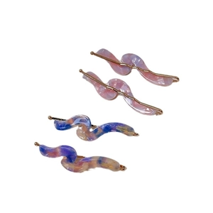 Set of wavy marble pattern acetate hair clips in pink and blue purple tones