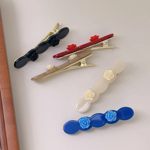 Five-piece set of elegant rose acetate hair clips in black, red, blue, cream, and brown