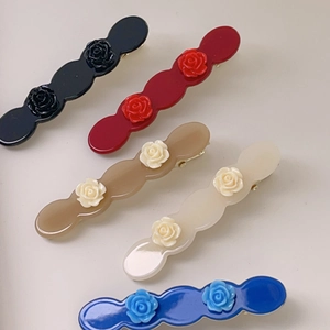 Elegant rose floral acetate hair clips with wavy edges and gold metal spring closure