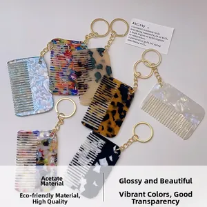 Flat lay of colorful acetate comb keychains in tortoiseshell and marble patterns