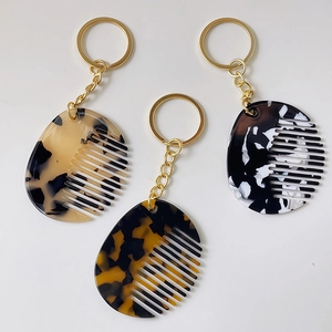 Mini acetate comb keychain set in leopard and marble patterns with golden metal ring