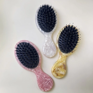 Portable acetate hair brush set with boar bristles and marble pattern handles in three colors