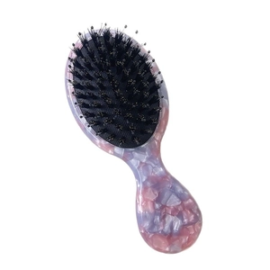 Portable pink marble acetate hair brush with boar bristles and cushion massage pins