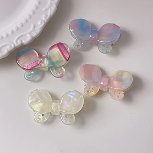 Set di quattro fermagli per capelli a farfalla con texture marmorizzata e strass su ceramica