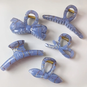 Lavender lace-patterned acrylic hair claw clips set with elegant gold accents