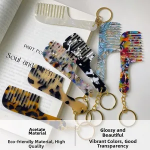 Detail of colorful acetate comb keychains featuring tortoiseshell and floral patterns