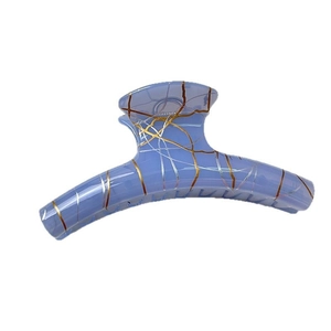 Elegant blue translucent hair claw clip with gold and silver line patterns on white background