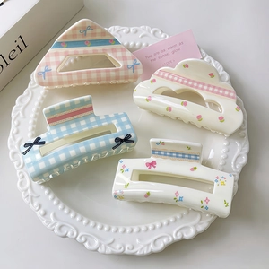 Sweet floral and checkered bow hair claw clip set in decorative white tray
