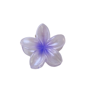 Macro view of purple gradient orchid hair claw clip with resin floral petal details