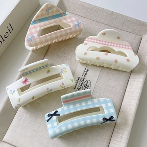 Floral and checkered acrylic hair claws in sweet macaron colors with bow patterns