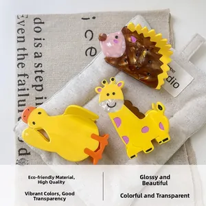 Detailed view of high-quality acetate animal hair clips featuring hedgehog and giraffe