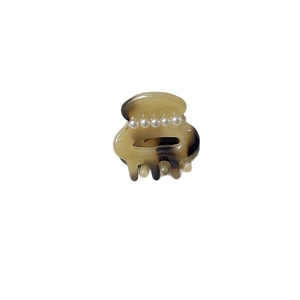 Mini amber marble acetate hair claw clip with five white pearl accents for women