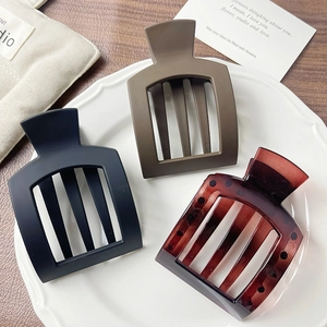 Three-piece set of matte black, brown, and amber hollow square hair claw clips