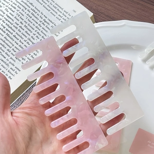 Elegant wide-tooth marble acetate combs for curly hair styling and scalp massage