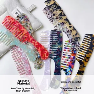 Detailed view of high-gloss acetate wide-tooth combs with marble patterns and carry bag