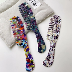 Chic marble patterned acetate wide tooth combs with ergonomic handle in vibrant colors