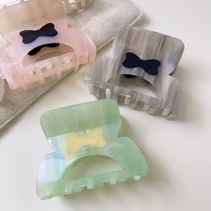 Tre fermagli per capelli in acetato con fiocco rosa, grigio e verde effetto marmo