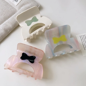 Set di 3 mollette per capelli in acetato con fiocco in colori pastello marmorizzati