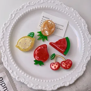 Cute set of 5 rhinestone-studded fruit-shaped acetic acid hair clips in a white plate