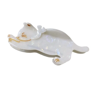 Elegant white acetate jumping cat hair claw clip with pearlescent finish and gold details