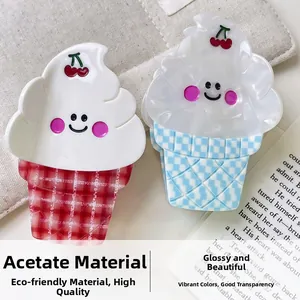 Detail of high-quality acetate hair claws in ice cream shape with cherry and smiley face