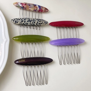Handmade acetate hair combs in various colors with elegant metallic silver teeth