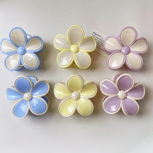 Set of 6 colorful matte flower hair claws in macaron tones for women styling