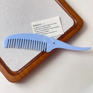 Peigne à cheveux bleu en acétate forme éléphant avec poignée ergonomique de style