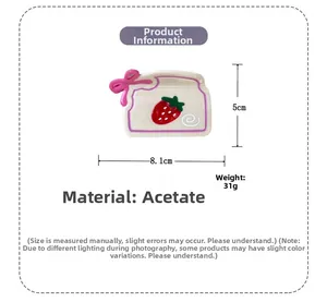 Détail de la pince à cheveux boîte fraise avec dimensions 8,1cm x 5cm et un poids de 31g