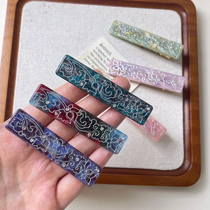 Floral acetate hair clips with rhinestones in various marble colors and retro design