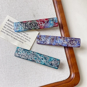 Retro marble acetate hair clip set with floral patterns and sparkling rhinestones