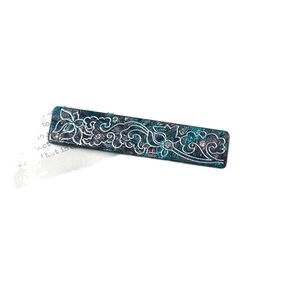 Elegant rectangular acetate hair clip in navy blue with lotus patterns and sparkling rhinestones