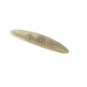 Elegant cream-colored acetate hair clip with sparkling rhinestone floral patterns