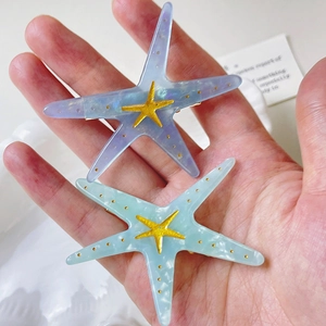 Y2K acetate starfish hair clips in lavender and mint green with gold accents