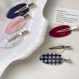 Lot de six barrettes ovales en acétate colorées avec étiquettes dorées France Handmade